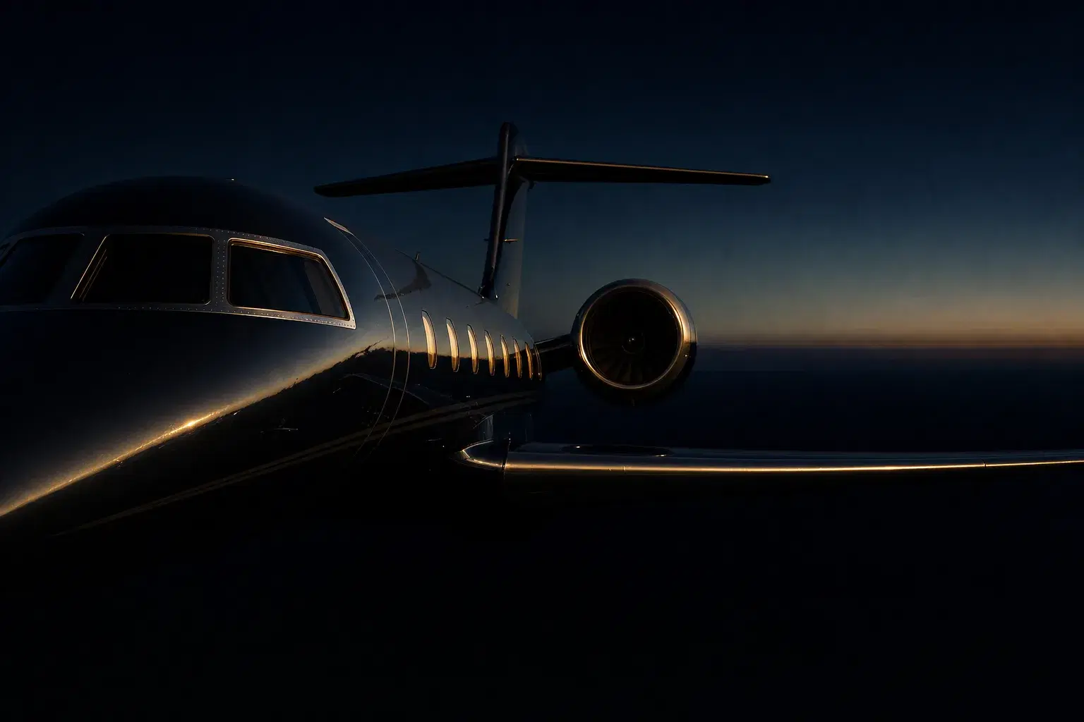 Private jet parked in front of a business aviation terminal, separate from the airline terminal